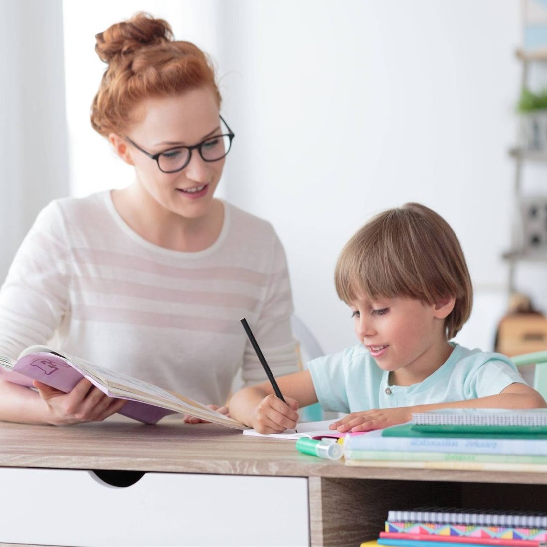 Online K–5 tutor working one-on-one with a young student on writing